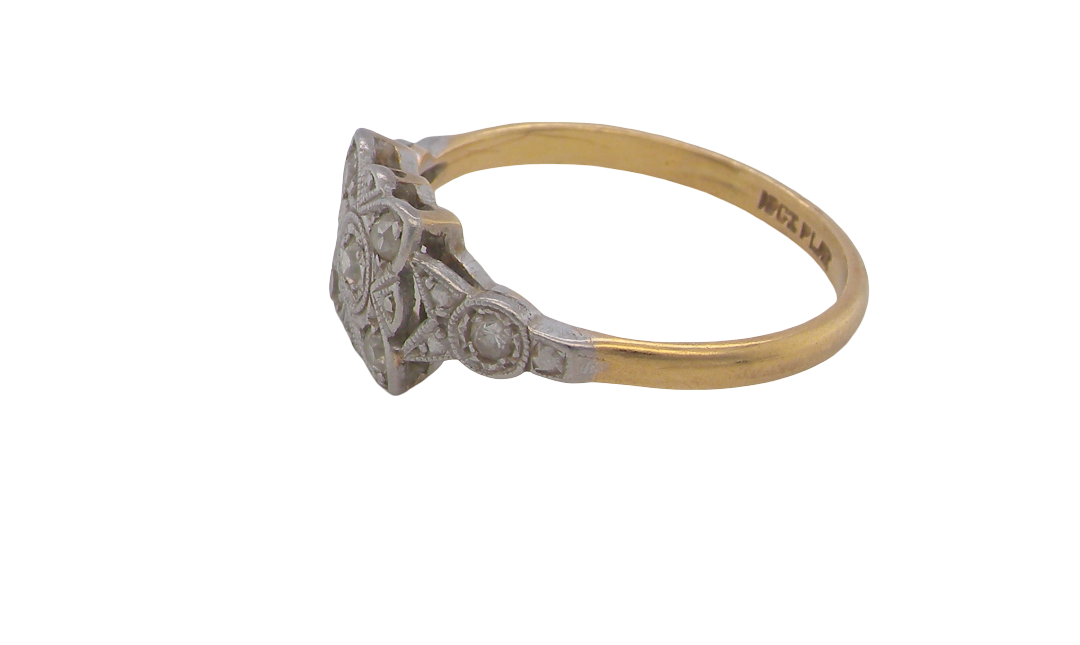 side A pretty diamond cluster ring from the early part of the 20th century. A square head that has within it small white diamonds, measures 8x8mm, fancy shoulders also set with tiny diamonds.