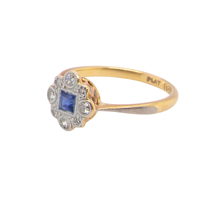 side A pretty early 20th century cluster ring. The centre stone a square mid blue sapphire, 3x3mm, mille grain setting. 