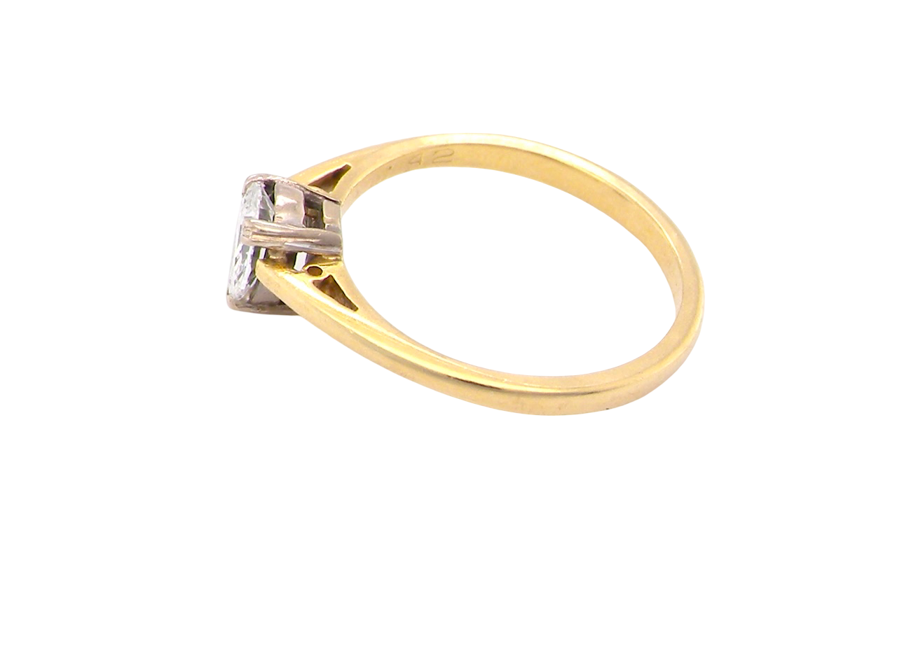 Gold ring with a diamond on a white background