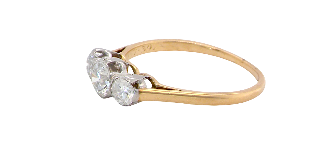 side A pretty three stone trilogy ring that features three brilliant cut white diamonds.
Centre diamond, 5mm (est 0.50 carats) each side a 4mm diamond (est 0.25 carats). Colour G-h, clarity Si. Platinum rim style setting, head measures 12.7x5.3mm, depth 5.3mm, weight 2.4grams.