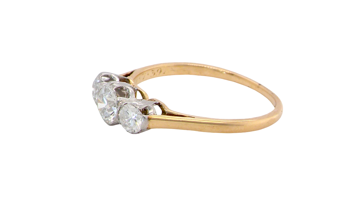 side A pretty three stone trilogy ring that features three brilliant cut white diamonds.
Centre diamond, 5mm (est 0.50 carats) each side a 4mm diamond (est 0.25 carats). Colour G-h, clarity Si. Platinum rim style setting, head measures 12.7x5.3mm, depth 5.3mm, weight 2.4grams.