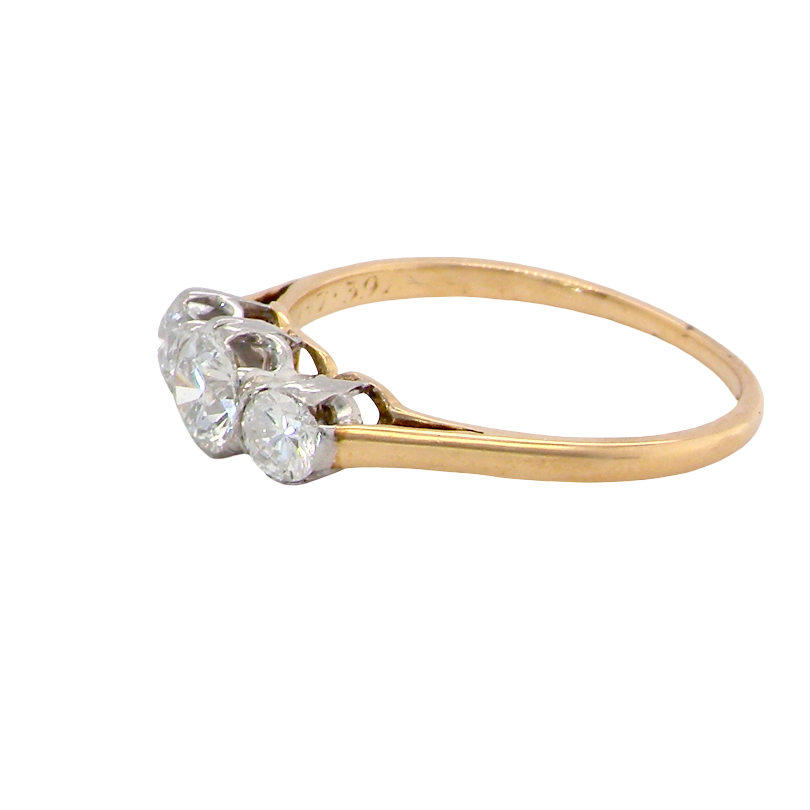side A pretty three stone trilogy ring that features three brilliant cut white diamonds.
Centre diamond, 5mm (est 0.50 carats) each side a 4mm diamond (est 0.25 carats). Colour G-h, clarity Si. Platinum rim style setting, head measures 12.7x5.3mm, depth 5.3mm, weight 2.4grams.