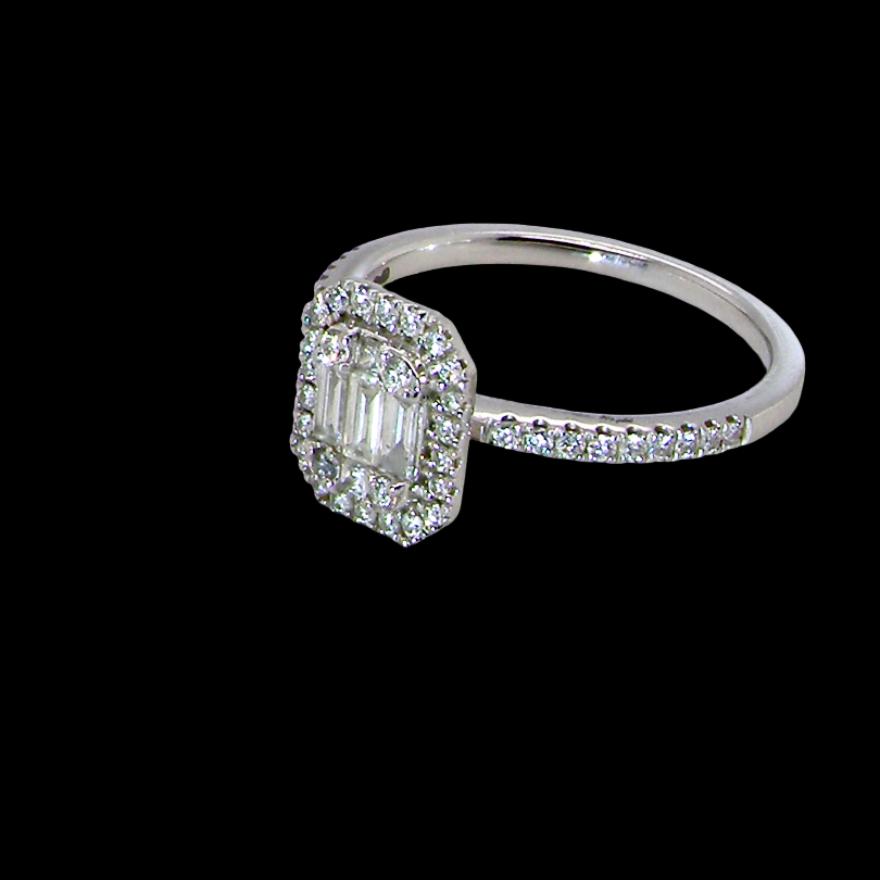 side A rectangular diamond cluster ring. Centre portion is set with three baguette cut white diamonds 3x1.6mm and six mixed cut diamonds 2mm each.
Surrounded by a halo of twenty two small round diamonds