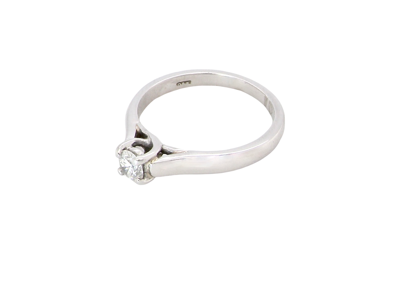 side A single stone solitaire diamond ring. The modern brilliant cut white diamond measures 3.9mm (0.22 carats est) Colour G-h, clarity VS.