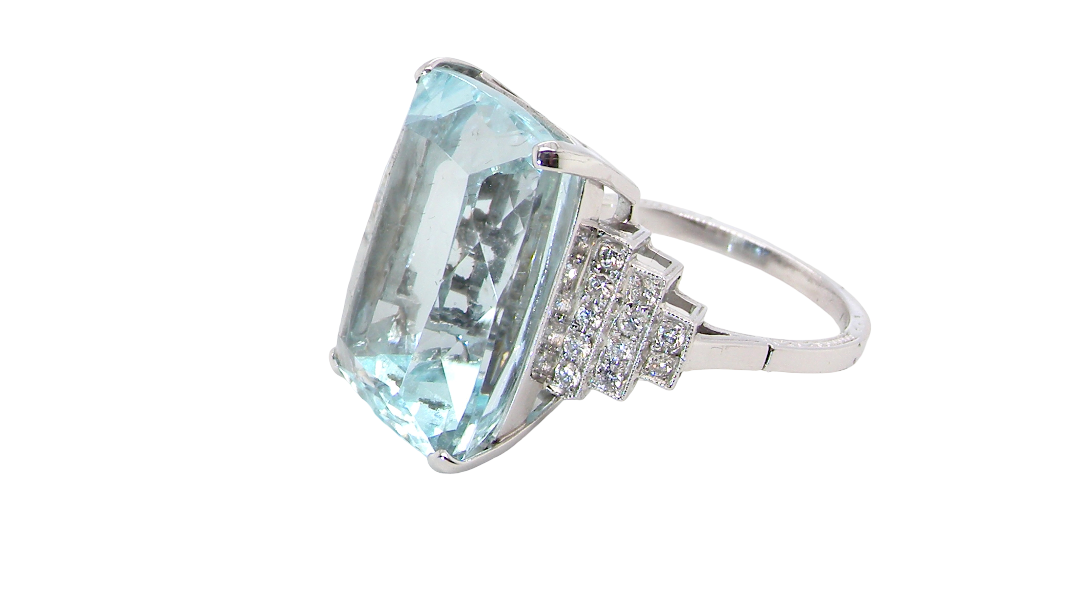 side A spectacular vintage statement ring, centred with an impressive rectangular-cut aquamarine of exceptional proportions. Measuring approximately 18 x 13mm with a depth of 11mm, the aquamarine is estimated to weigh around 18 carats