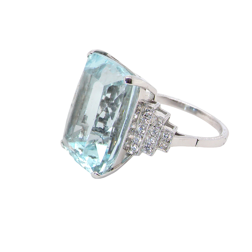 side A spectacular vintage statement ring, centred with an impressive rectangular-cut aquamarine of exceptional proportions. Measuring approximately 18 x 13mm with a depth of 11mm, the aquamarine is estimated to weigh around 18 carats