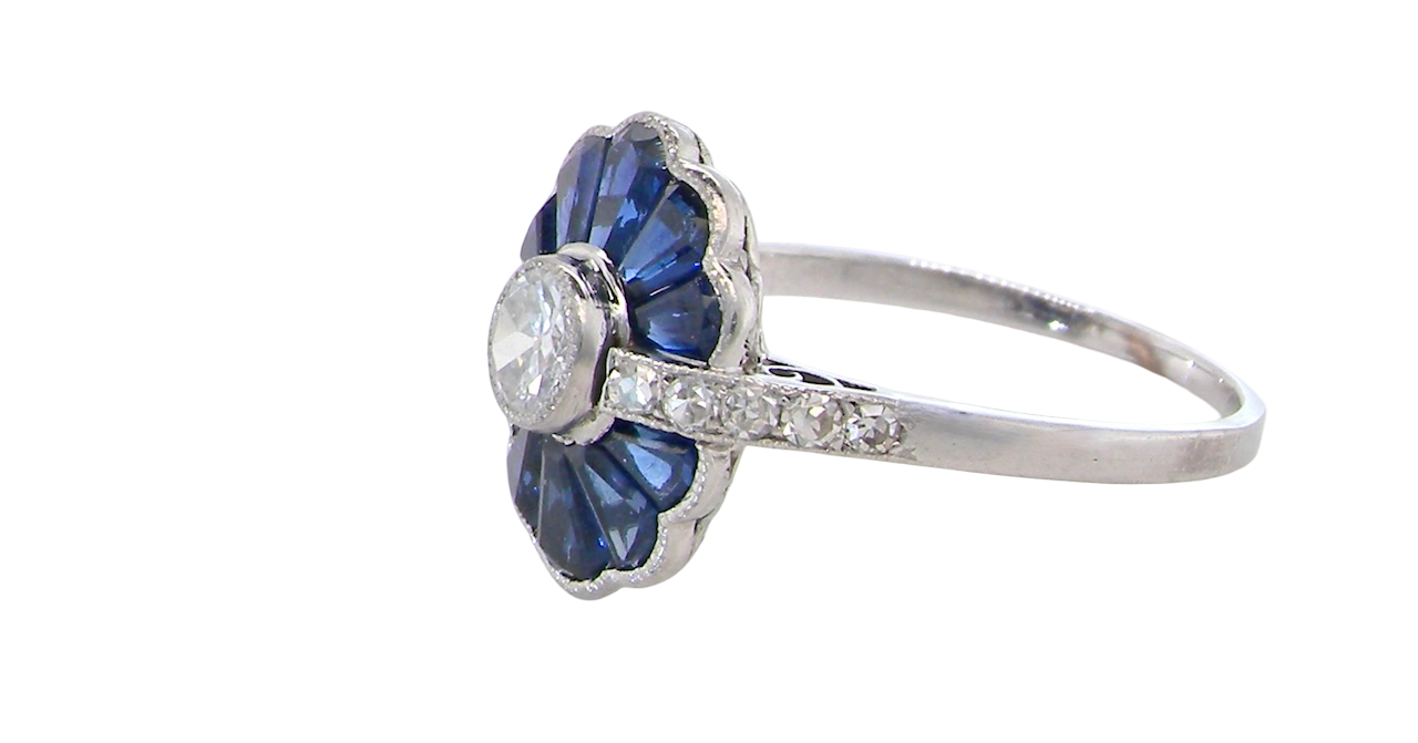 side A striking and highly unusual Art Deco cluster ring featuring a distinctive fan-shaped design.