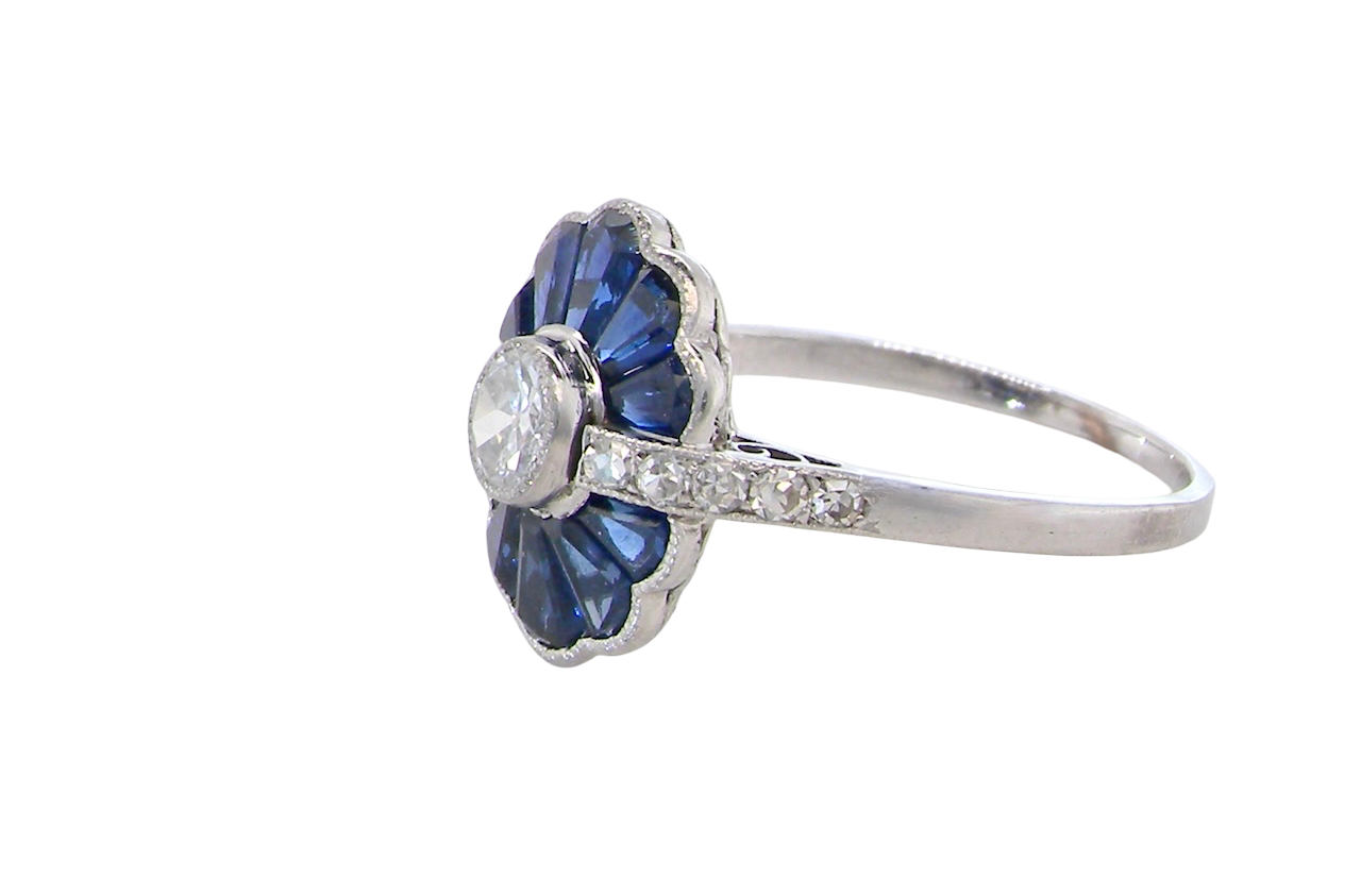 side A striking and highly unusual Art Deco cluster ring featuring a distinctive fan-shaped design.