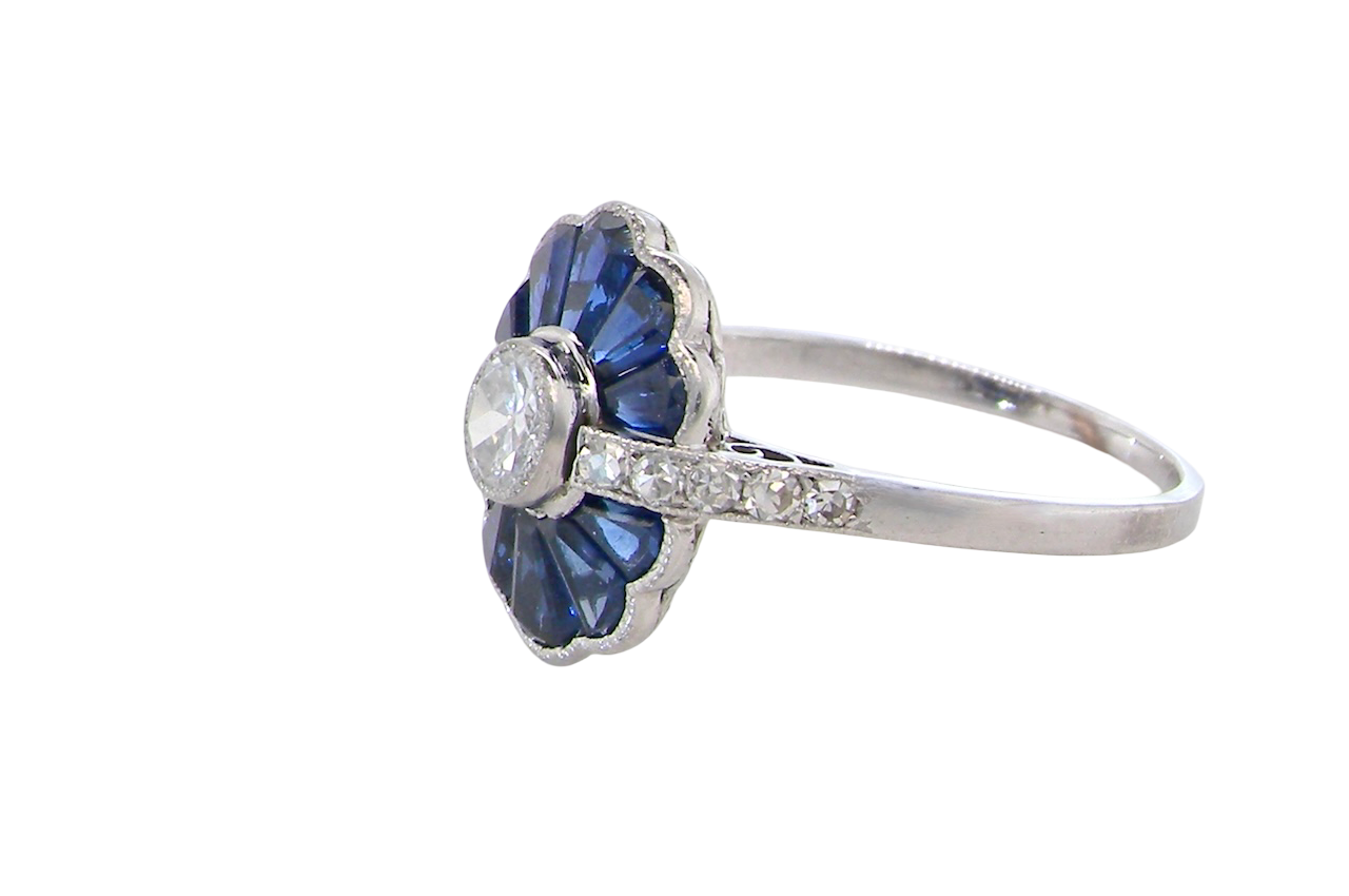 side A striking and highly unusual Art Deco cluster ring featuring a distinctive fan-shaped design.
