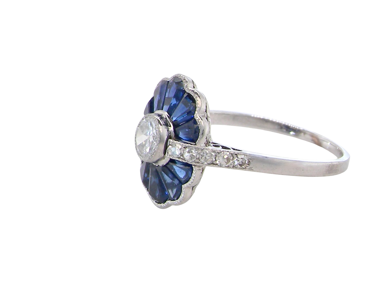 side A striking and highly unusual Art Deco cluster ring featuring a distinctive fan-shaped design.