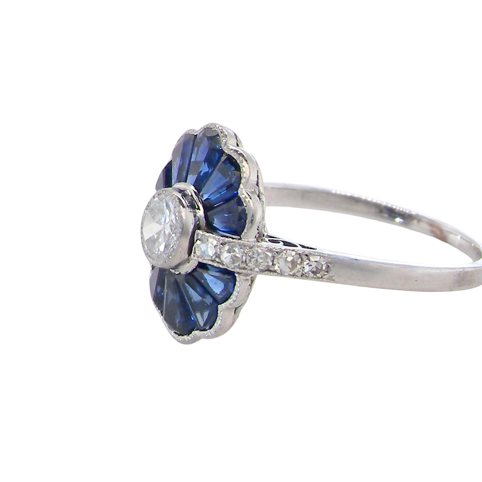 side A striking and highly unusual Art Deco cluster ring featuring a distinctive fan-shaped design.