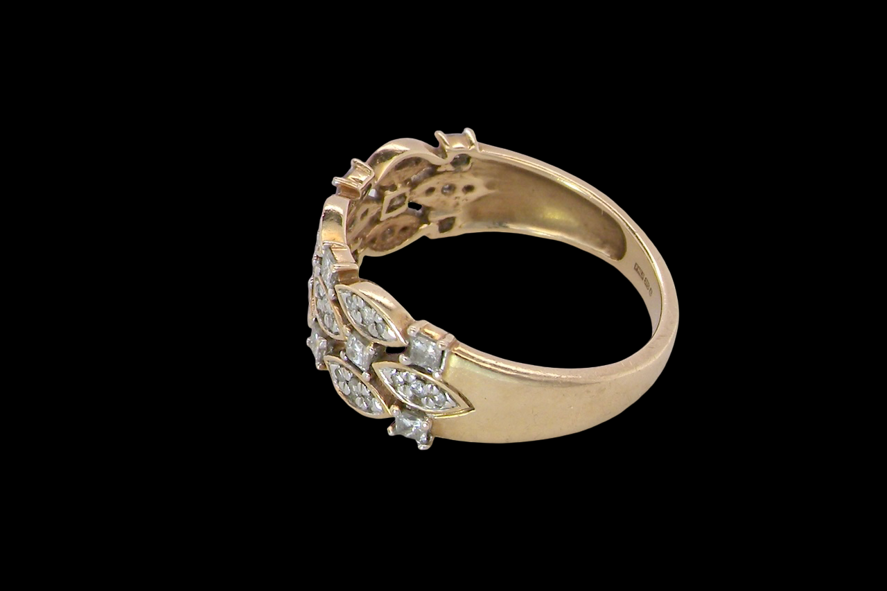 side A striking half-hoop style ring featuring three diamond-set bands