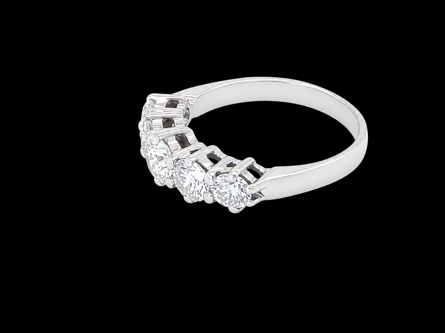 side A stunning half hoop ring featuring five exceptional brilliant-cut white diamonds, expertly claw set in 18ct white gold.
The centre diamond measures approximately 5.8mm (estimated 0.70 carats), flanked by a 5.0mm diamond on each side, with 4.5mm diamonds at each end.