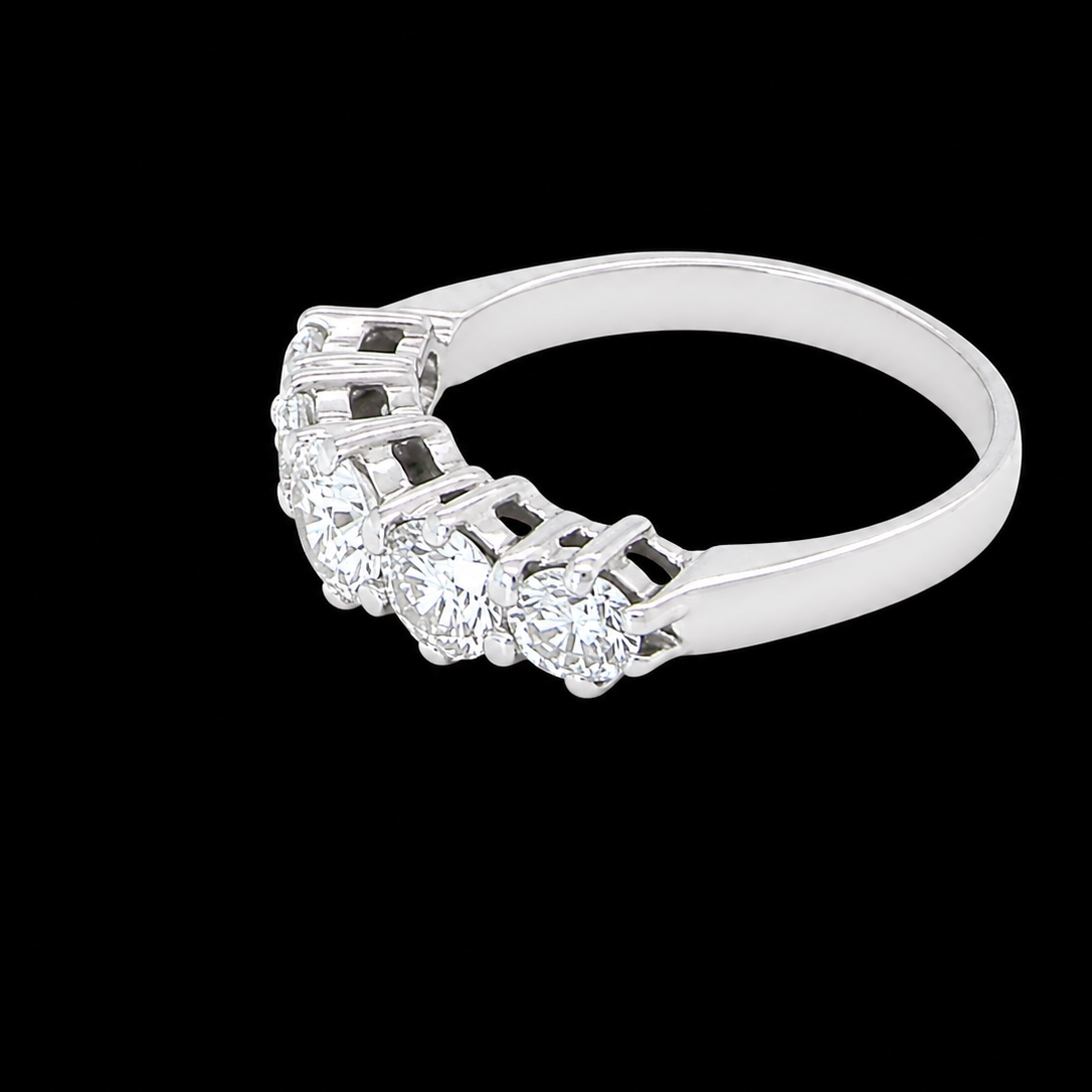 side A stunning half hoop ring featuring five exceptional brilliant-cut white diamonds, expertly claw set in 18ct white gold.
The centre diamond measures approximately 5.8mm (estimated 0.70 carats), flanked by a 5.0mm diamond on each side, with 4.5mm diamonds at each end.