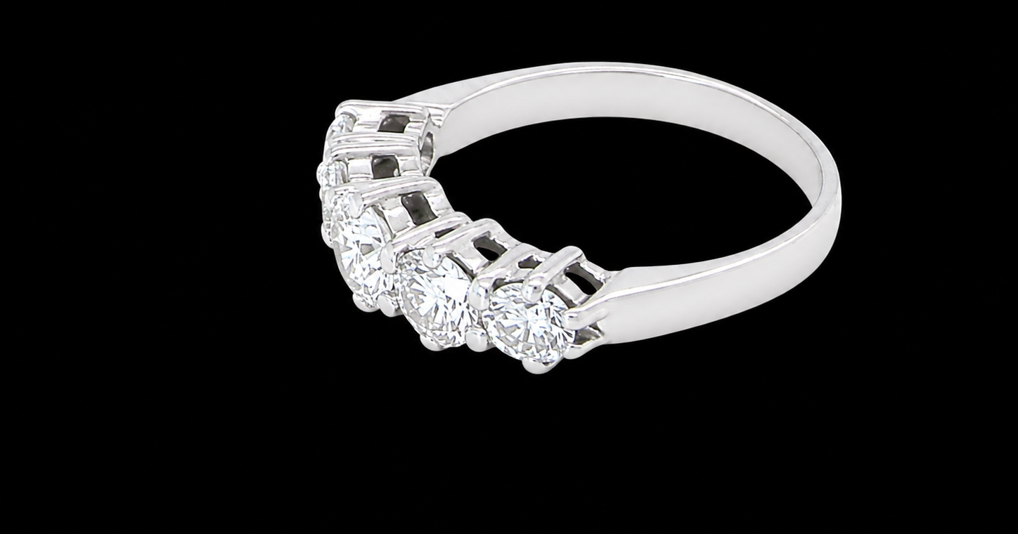 side A stunning half hoop ring featuring five exceptional brilliant-cut white diamonds, expertly claw set in 18ct white gold.
The centre diamond measures approximately 5.8mm (estimated 0.70 carats), flanked by a 5.0mm diamond on each side, with 4.5mm diamonds at each end.
