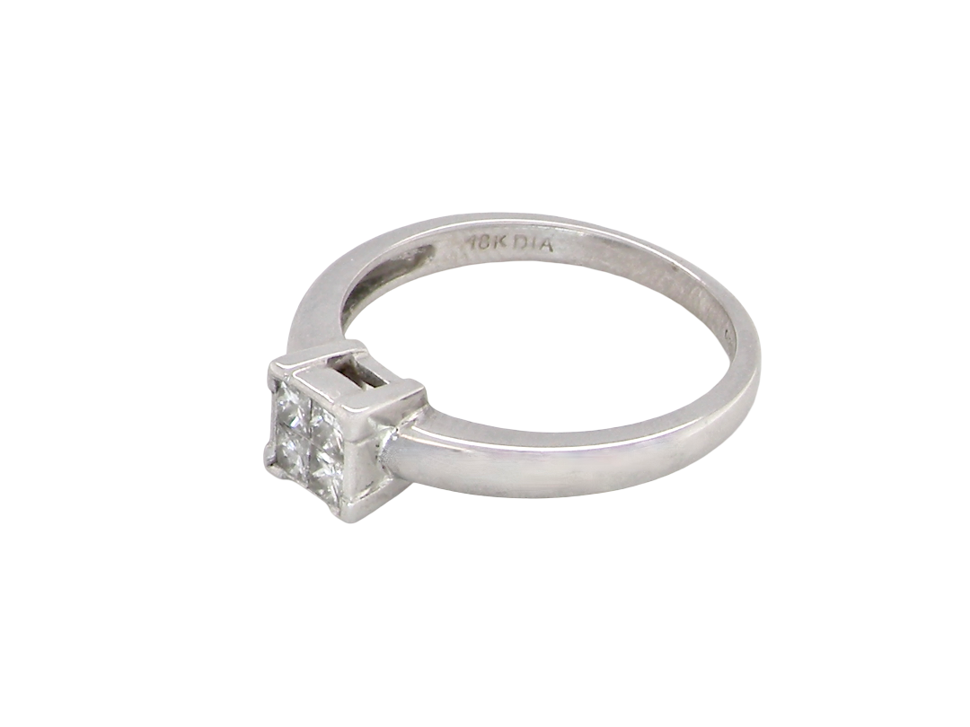 side A stylish modern 18 carat white gold diamond cluster ring, with a beautifully clean and understated design.
The square-shaped head is set with four Princess cut white diamonds,