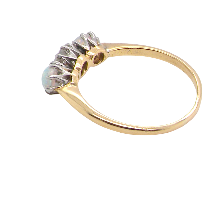 side A three stone ring, the centre stone an old brilliant cut white diamond 4.6mm (est 0.38 carats) colour i-j, clarity Si, claw set in platinum.