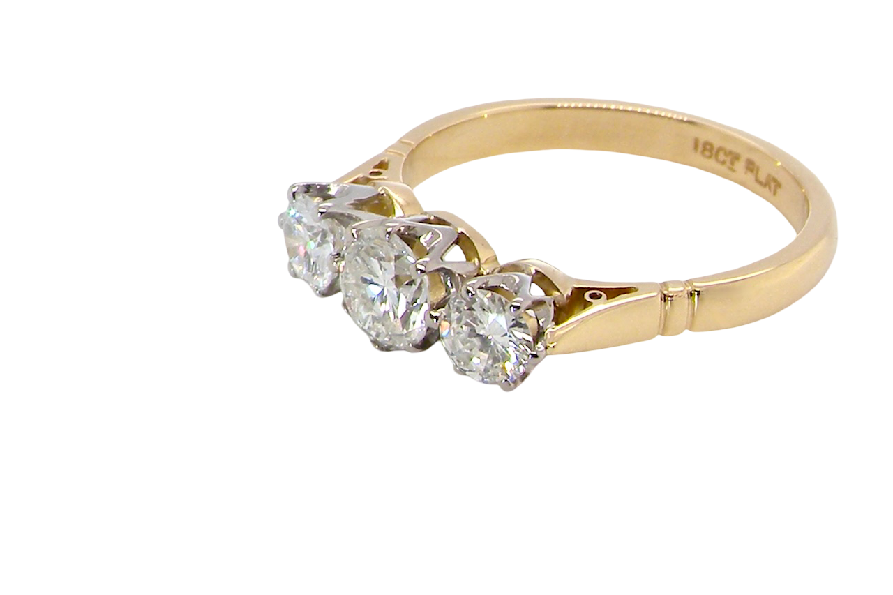 side A three stone trilogy ring. The diamond centre stone measures 5.5mm (est 0.60 carats) each side a 4mm diamond , total estimated at 1.10 carats.