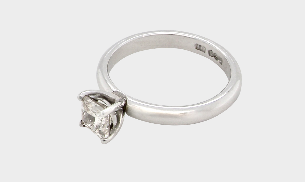side A timeless and beautifully crafted solitaire ring featuring a stunning 0.78 carat Princess-cut white diamond
