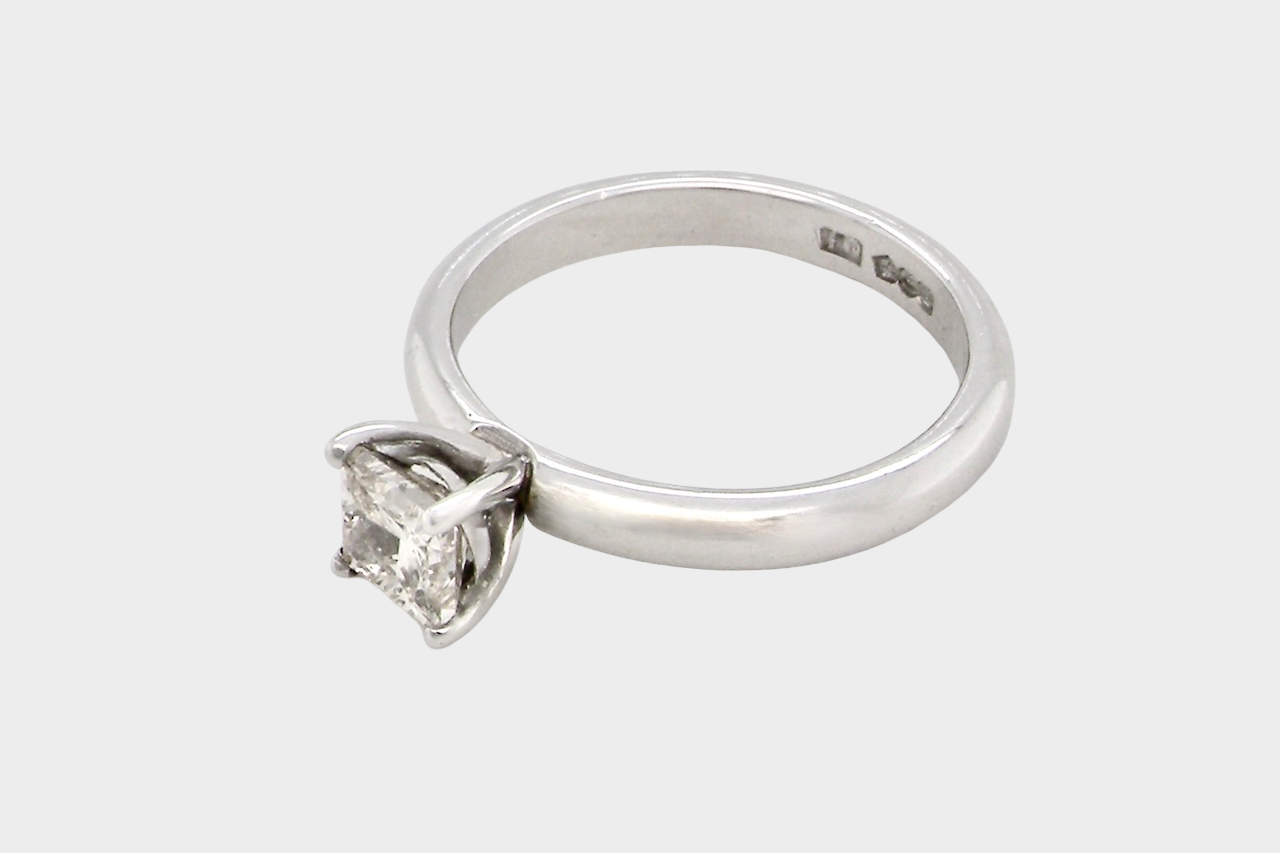 side A timeless and beautifully crafted solitaire ring featuring a stunning 0.78 carat Princess-cut white diamond
