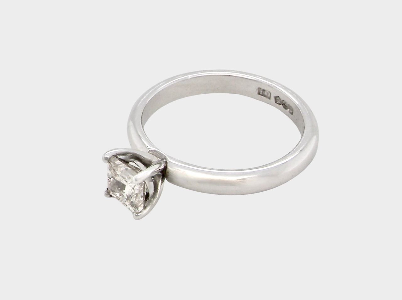 side A timeless and beautifully crafted solitaire ring featuring a stunning 0.78 carat Princess-cut white diamond