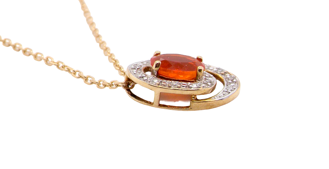 side A very pretty pendant set with a fireglow orange Fire Opal. Measures 6x4mm (0.50 carats).