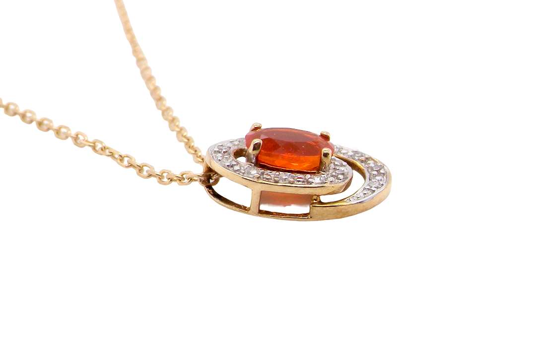 side A very pretty pendant set with a fireglow orange Fire Opal. Measures 6x4mm (0.50 carats).