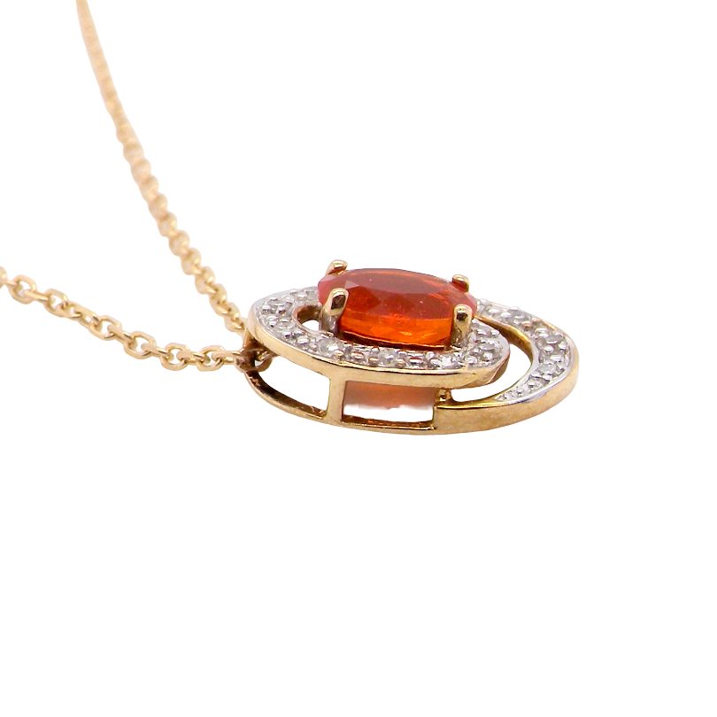 side A very pretty pendant set with a fireglow orange Fire Opal. Measures 6x4mm (0.50 carats).