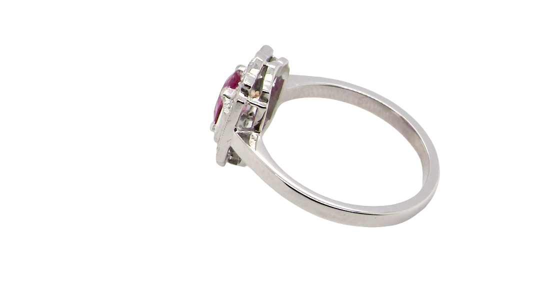 side A very pretty ring that features an oval cut pink sapphire, 6x4mm (est 0.50 carats). 