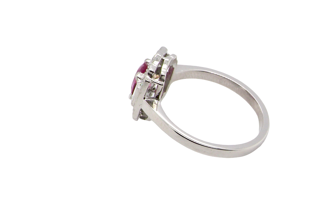 side A very pretty ring that features an oval cut pink sapphire, 6x4mm (est 0.50 carats). 