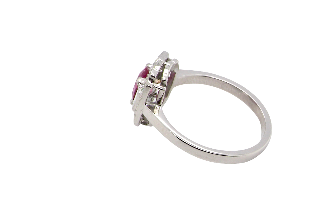 side A very pretty ring that features an oval cut pink sapphire, 6x4mm (est 0.50 carats). 