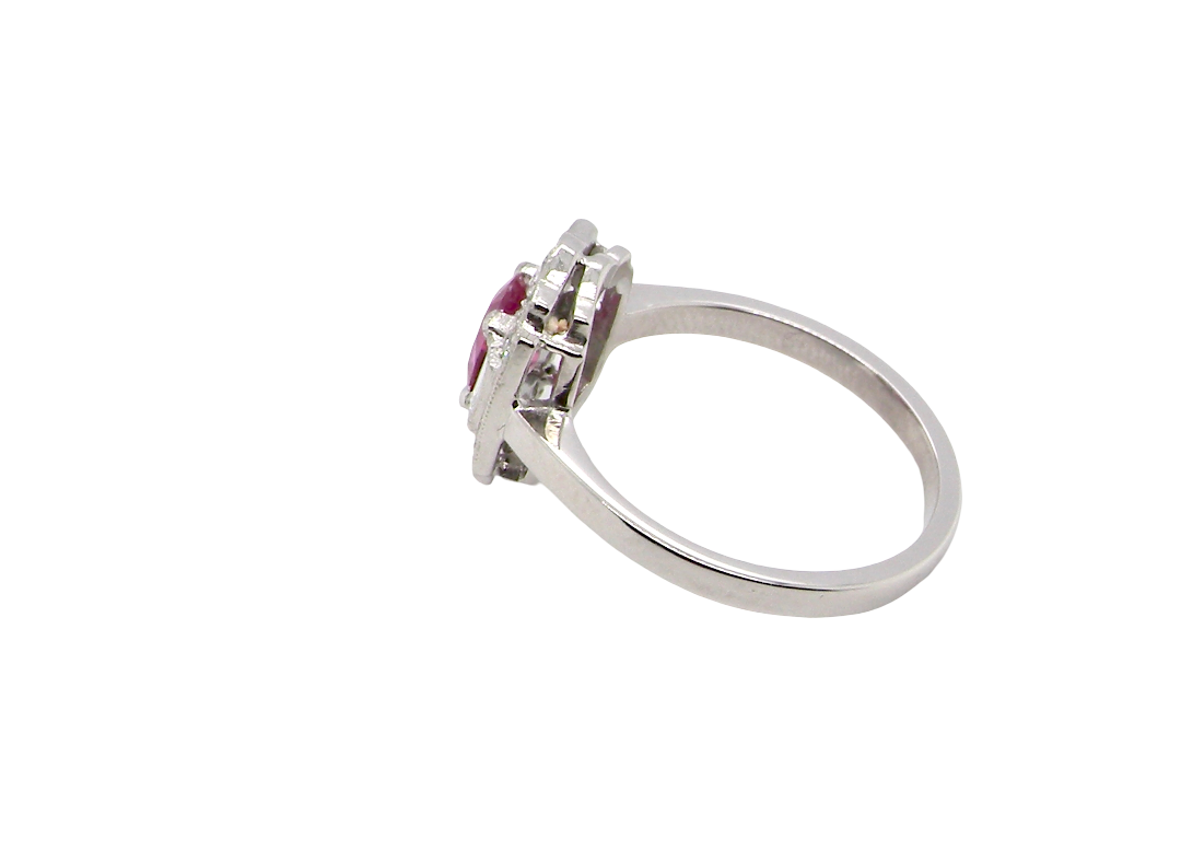 side A very pretty ring that features an oval cut pink sapphire, 6x4mm (est 0.50 carats). 