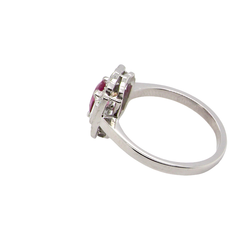 side A very pretty ring that features an oval cut pink sapphire, 6x4mm (est 0.50 carats). 