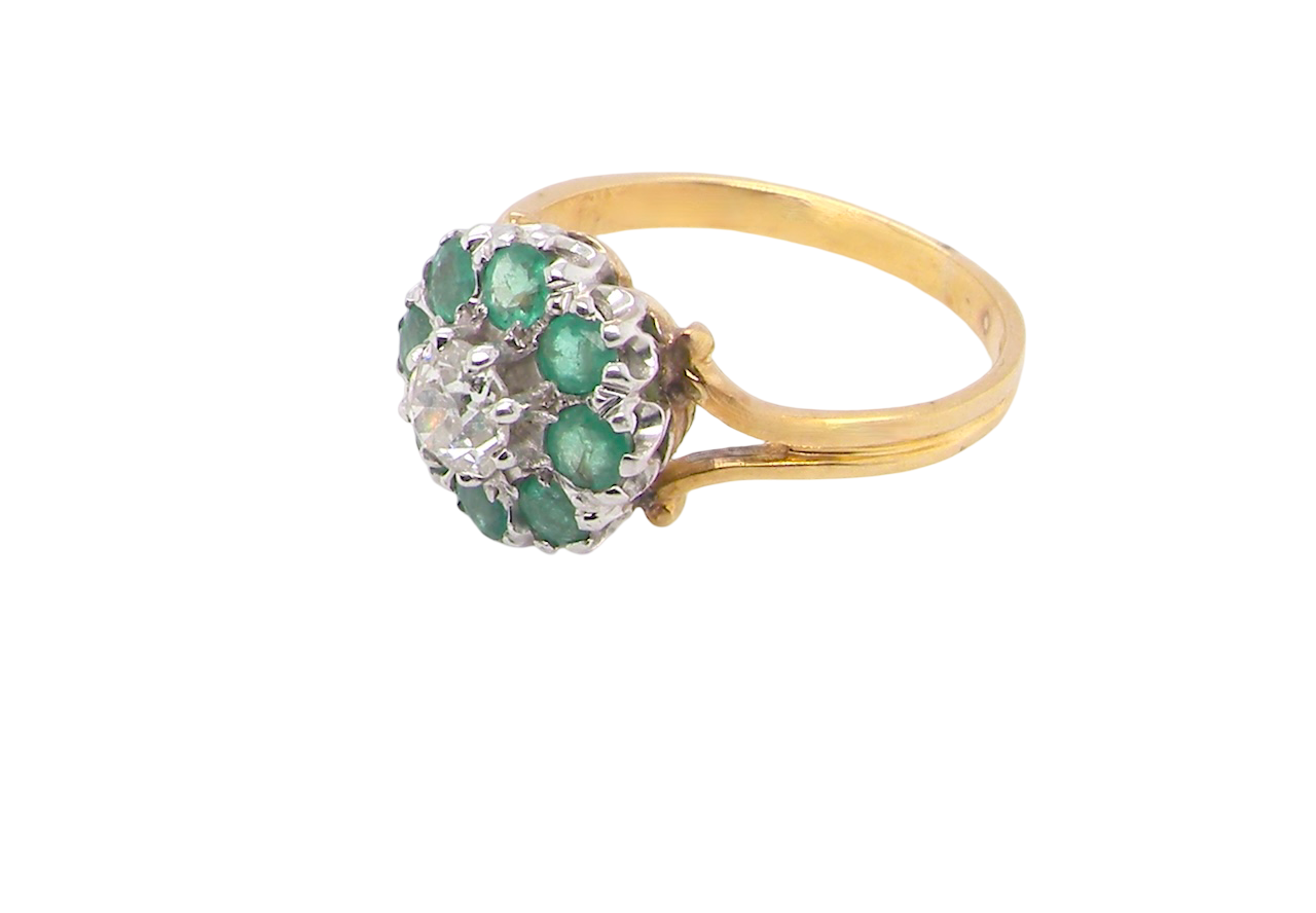 side A vintage 1960s cluster ring. Principal stone a brilliant cut white diamond, 0.45 carats (5mm diameter) 