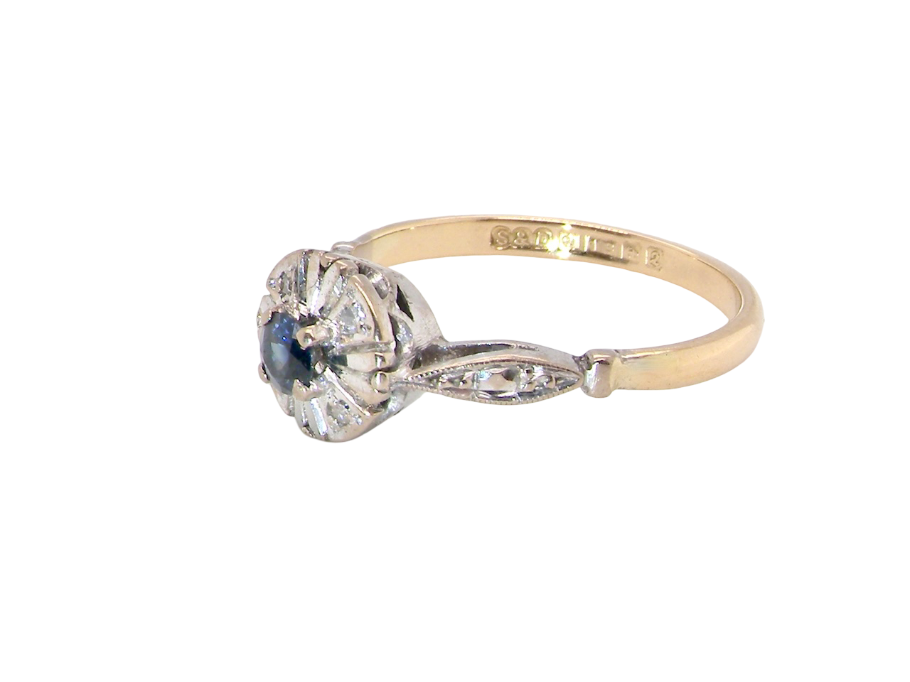 side A vintage cluster ring featuring a deep black-blue sapphire