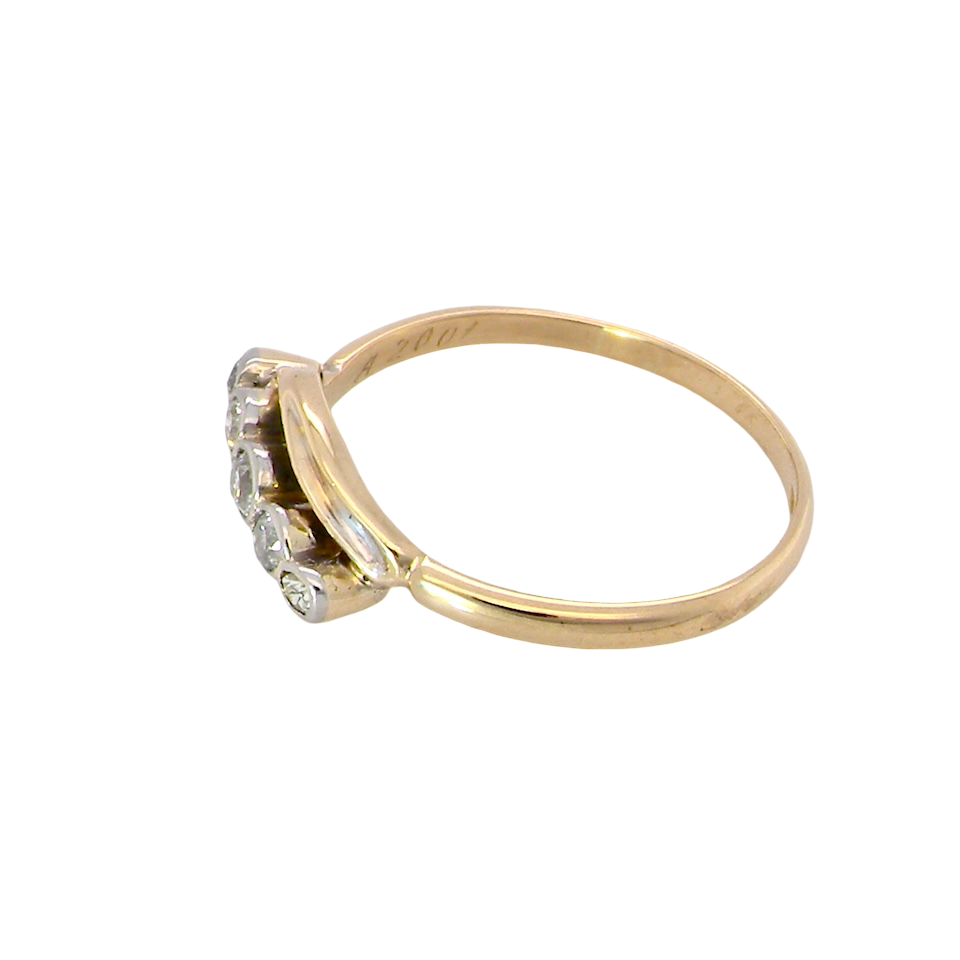 side A vintage cross over style ring. Set with five old brilliant cut white diamonds. Centre stone 3mm, each side 2.4mm, each end 1.5mm. Total diamond content estimated at 0.22 carats.