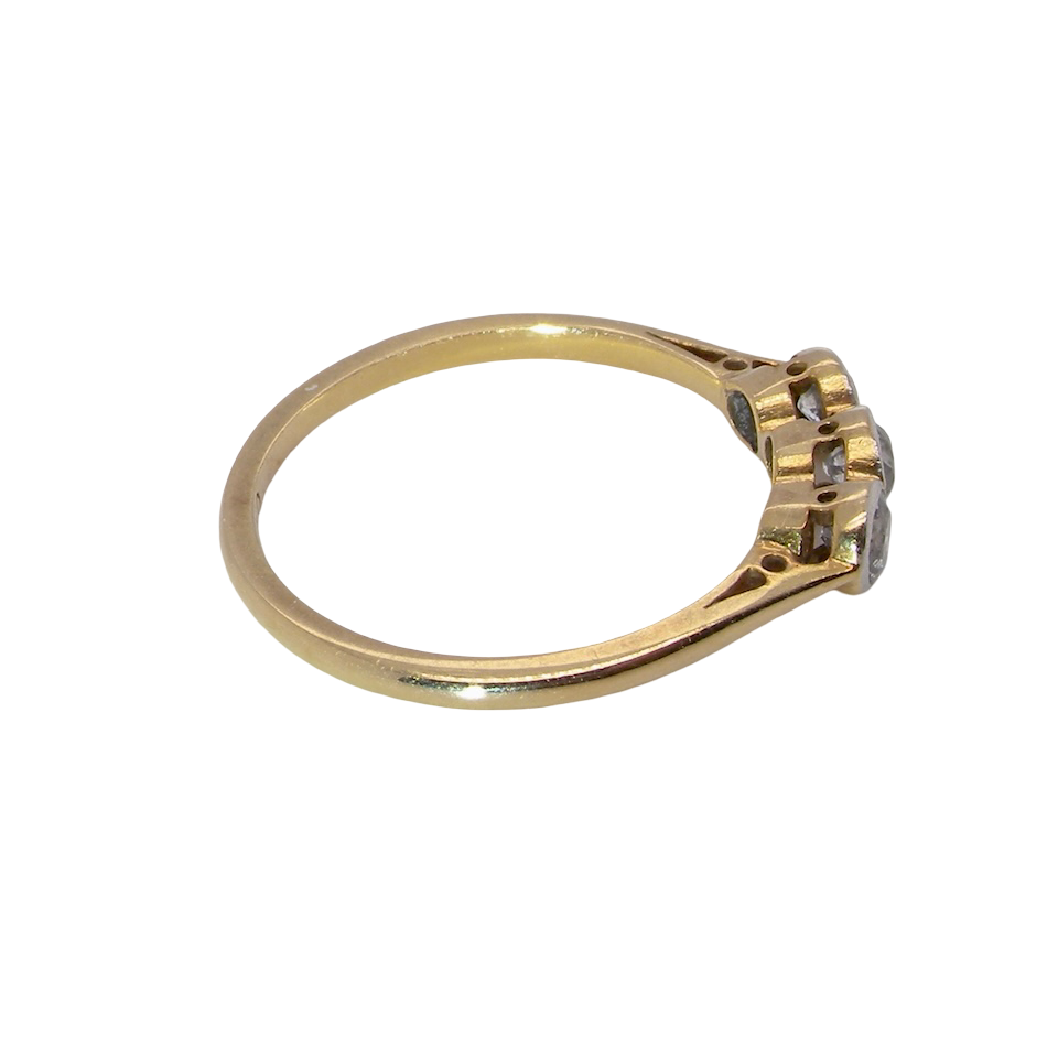 side A vintage early 20th century trilogy ring. Set with three old cut diamonds, centre stone 3.8mm, and each side a 3.6mm diamond (total carat weight estimated at 0.55 carats)
