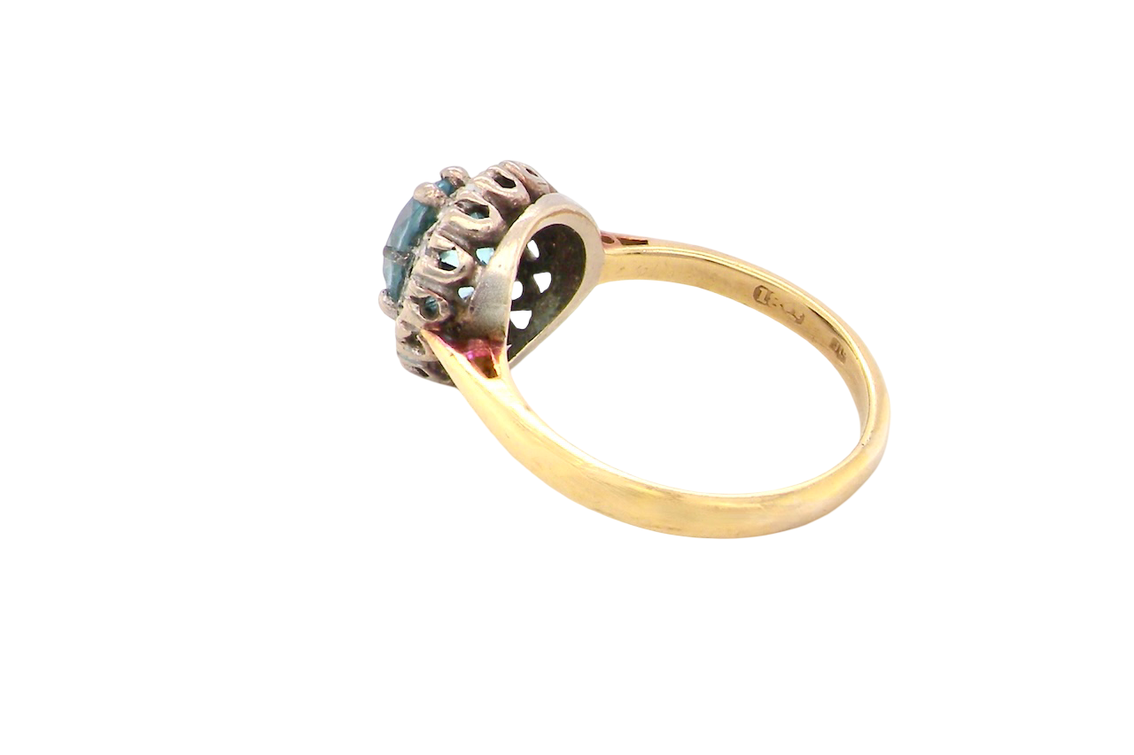 side A vintage mid 20th century cluster ring.
Centre stone a natural blue zircon, 7mm diameter.