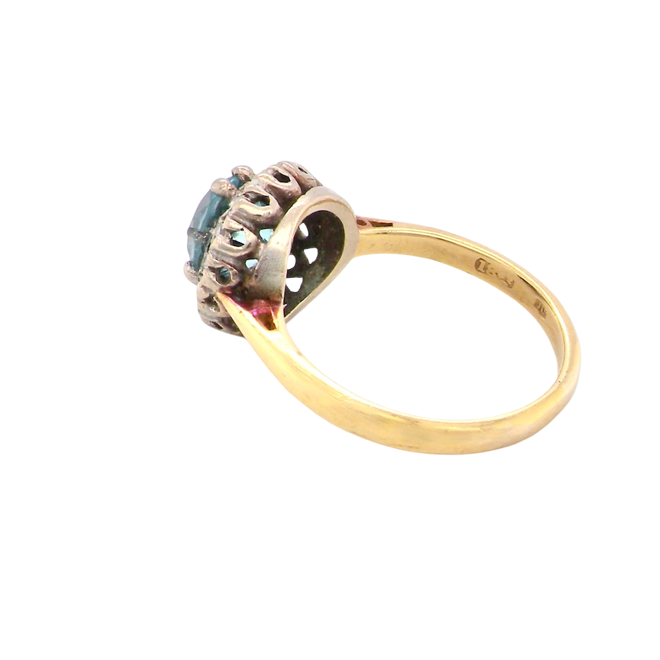 side A vintage mid 20th century cluster ring.
Centre stone a natural blue zircon, 7mm diameter.