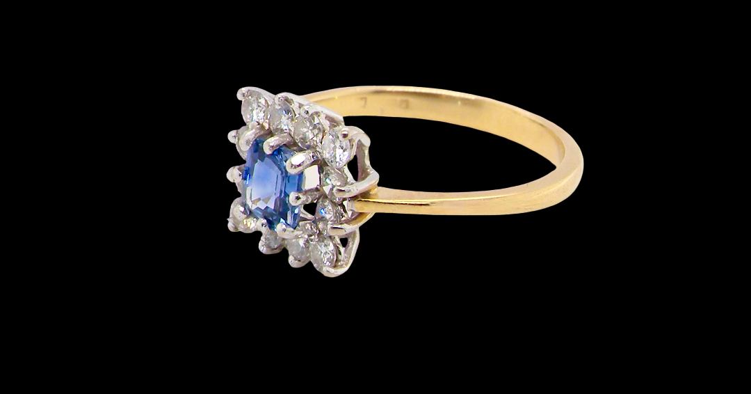 side A vintage square cluster ring. Features to the centre a square sapphire 5x5mm (est 0.50 carats) mid blue- cornflower hue. 