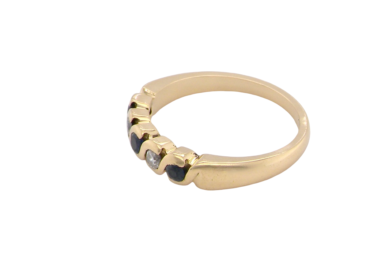 An 18 carat gold Sapphire and Diamond eternity ring