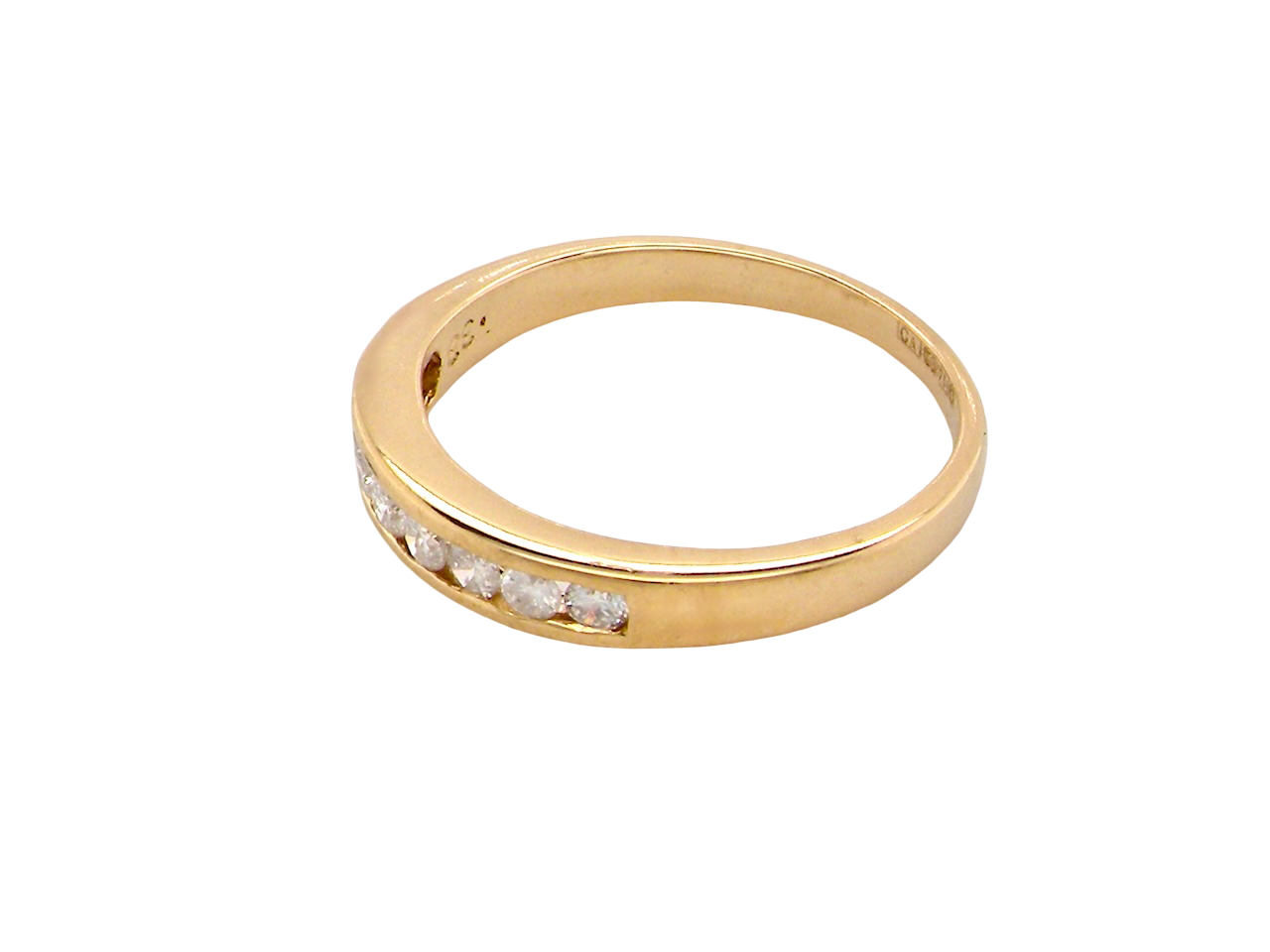 Gold ring with embedded diamonds on a white background