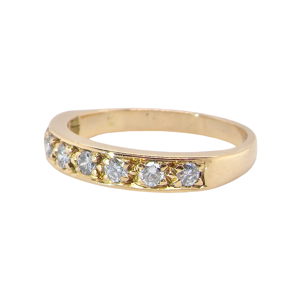 side An 18 carat gold half-hoop eternity ring, set with eight brilliant-cut white diamonds