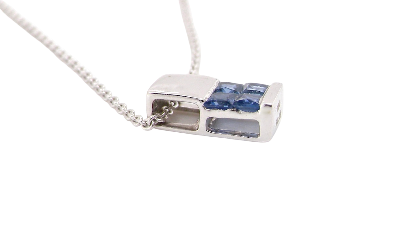 An 18 carat White Gold* Pendant with Sapphires