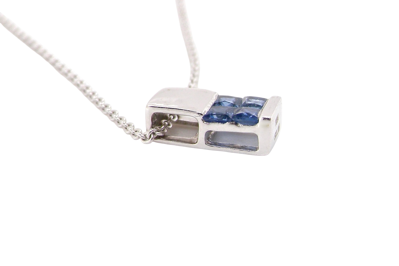 An 18 carat White Gold* Pendant with Sapphires