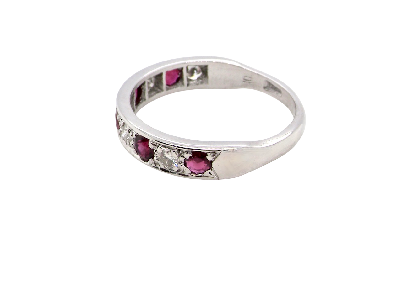 side An 18 carat white gold half hoop eternity ring. Set with five round 3mm rubies (est 0.50 carats) 