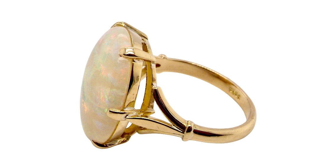 side An 18 carat yellow gold* dress ring set with a large oval opal gemstone.