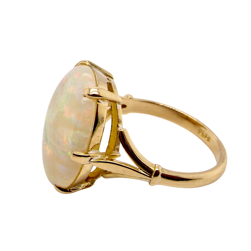 side An 18 carat yellow gold* dress ring set with a large oval opal gemstone.
