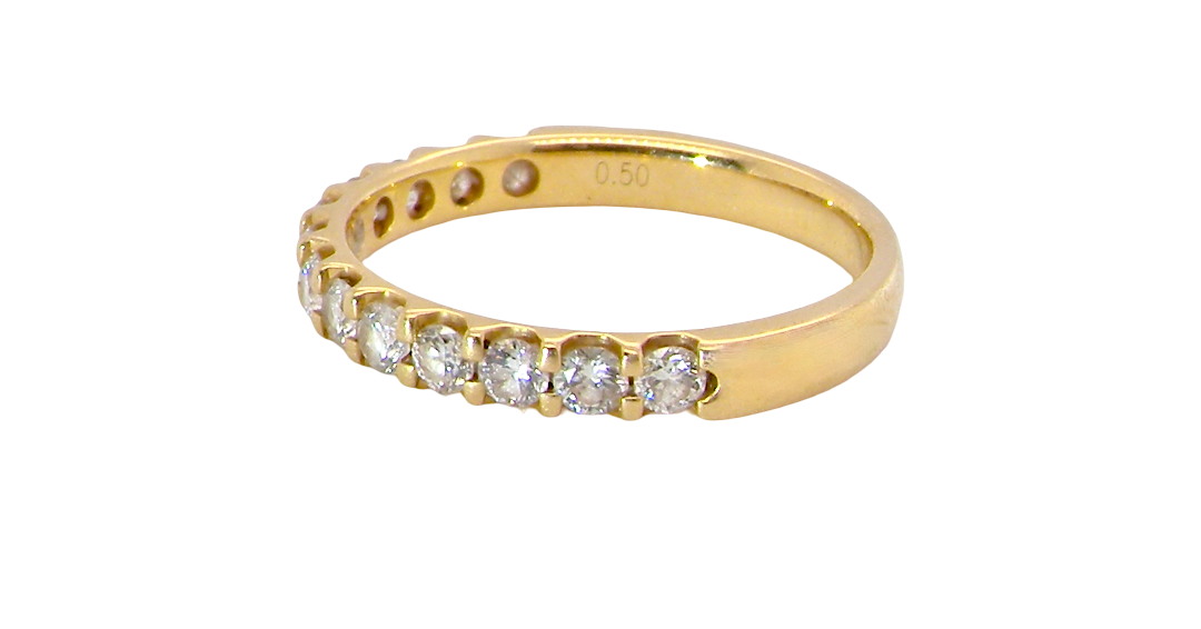 An 18 carat yellow gold half hoop diamond eternity ring originally purchased from Goldsmiths side view