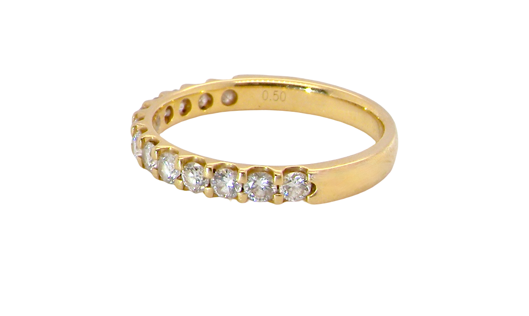 An 18 carat yellow gold half hoop diamond eternity ring originally purchased from Goldsmiths side view
